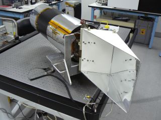 The Narrow Angle Camera on NASA's Lunar Reconnaissance Orbiter sits on a cleanroom bench before launch. The radiator (right) extends off the camera's electronics end and keeps the sensor cool. Computer modeling shows the meteoroid impacted somewhere on the radiator.