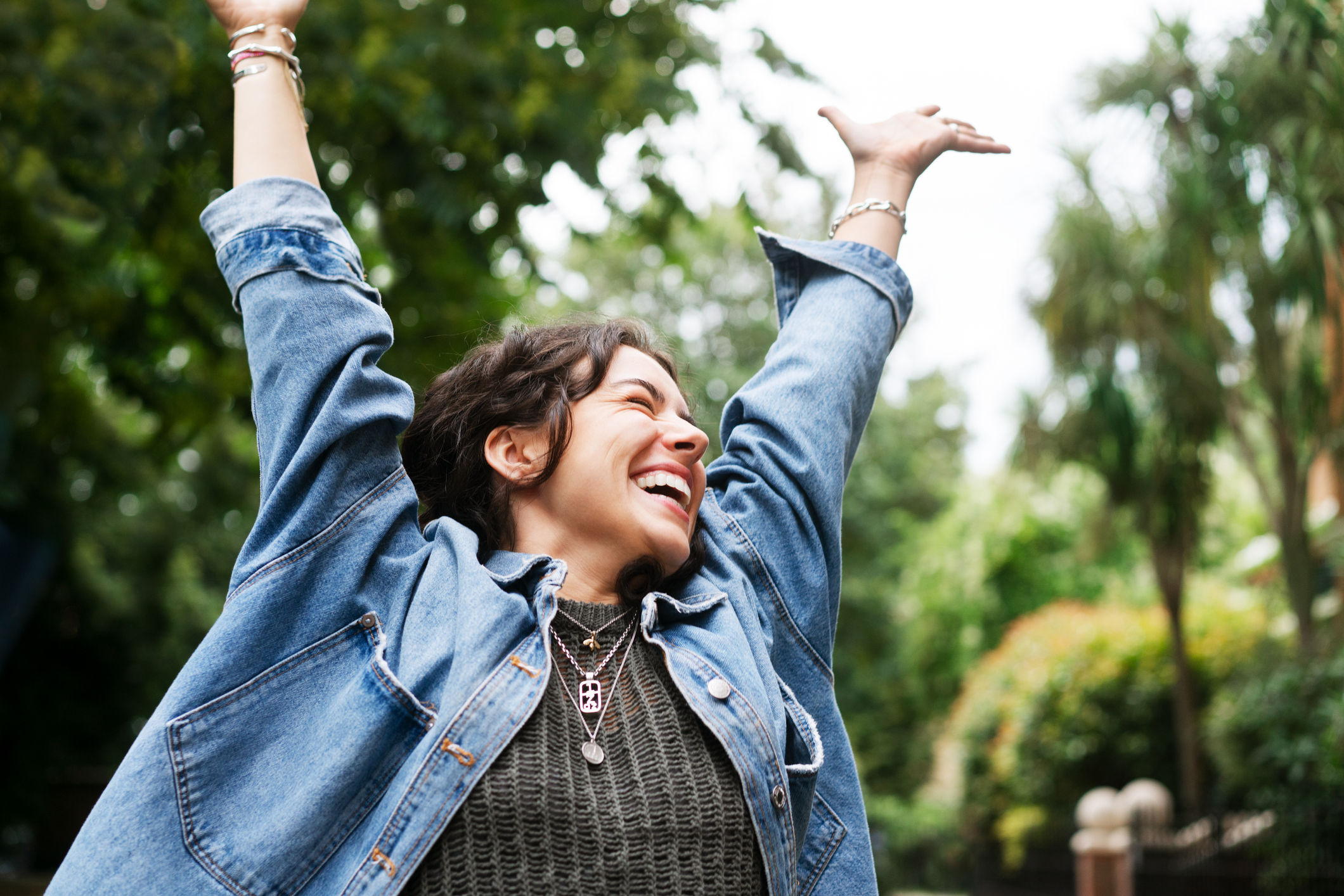 Happy woman outside property 