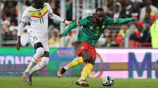 Nicolas Moumi Ngamaleu (R) on the ball ahead of the Senegal vs Cameroon live stream