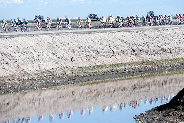 Riders go along one of the huge irrigation ditches