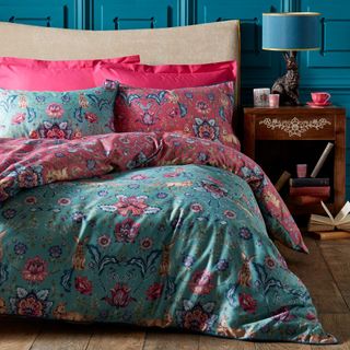bedroom with bed and floral bedsheet