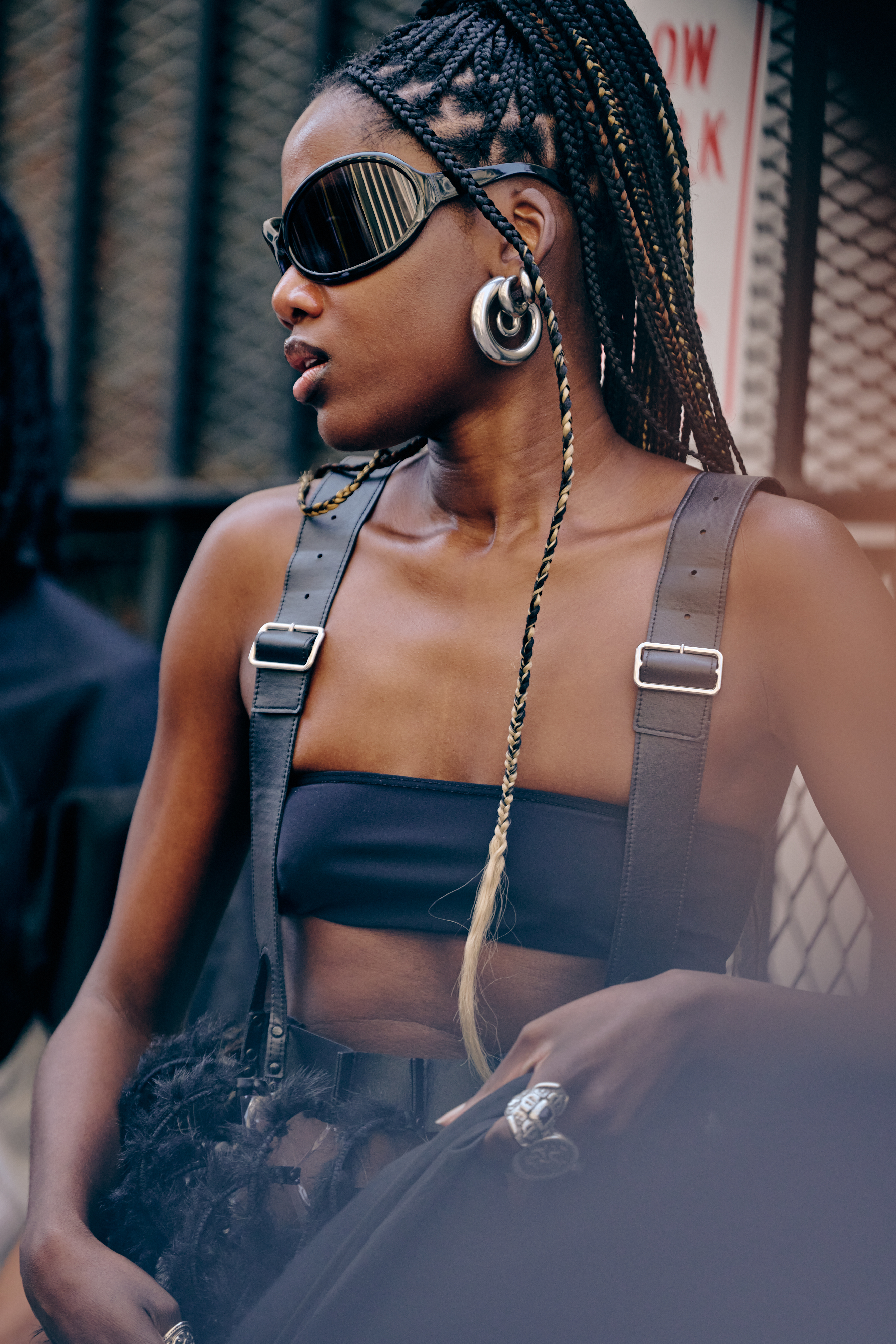 a fashion week guest wearing bug eye sunglasses
