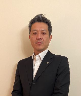 Headshot of TOA Electronics CEO and president Yuma Kawai .