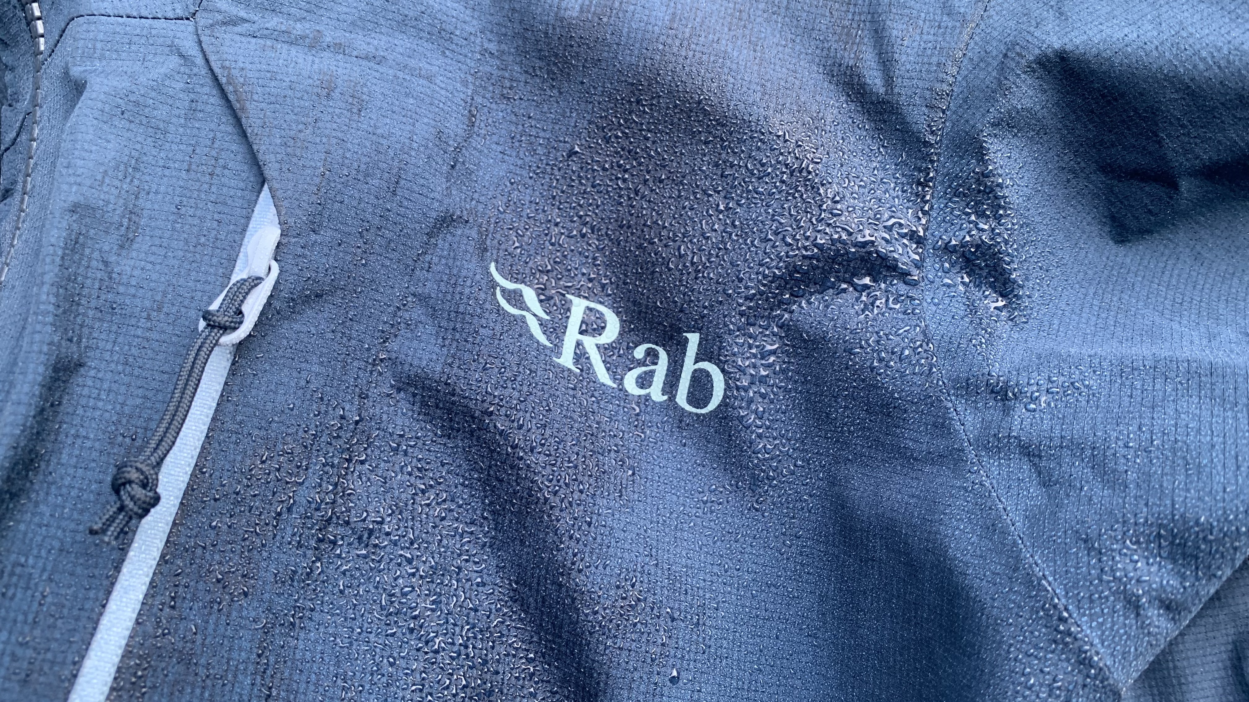 Close up of rain beading on Rab Alpine Firewall Jacket