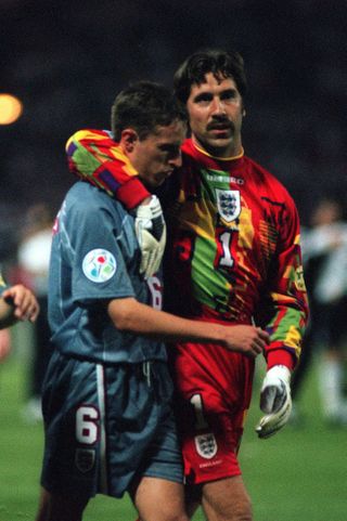 Seaman consoles Southgate after his penalty was saved in the shootout against Germany at Euro 96