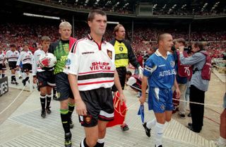 Roy Keane leads out Manchester United for the Charity Shield game against Chelsea in August 1997.