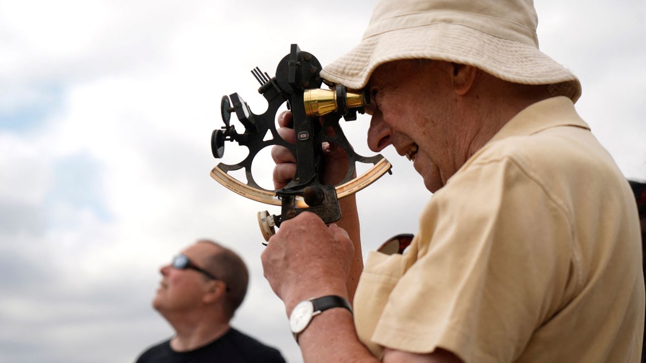 A skywatcher in London uses a sextant to observe the partial solar eclipse on June 10, 2021.