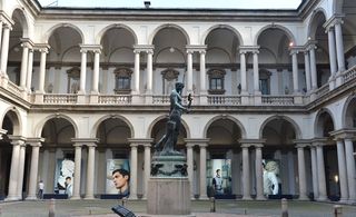 Photographs were arranged around the arcades of the Milanese academy's inner courtyard