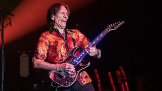 Steve Vai live onstage with the original G3 lineup in 2024