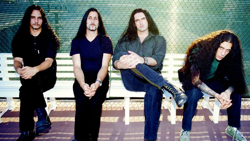 Type O Negative sitting on a bench looking moody