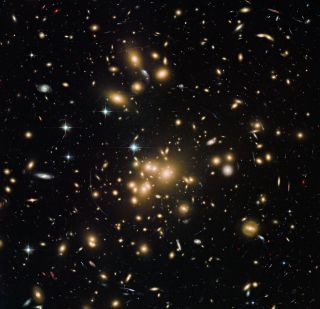 This new Hubble image shows galaxy cluster Abell 1689. It combines both visible and infrared data from Hubble’s Advanced Camera for Surveys (ACS) with a combined exposure time of over 34 hours to reveal this patch of sky in greater and more striking detail than in previous observations.
