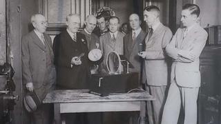 C. Frances Jenkins (second from left) explains the workings of his apparatus to those present at his June 13, 1925, television demonstration.