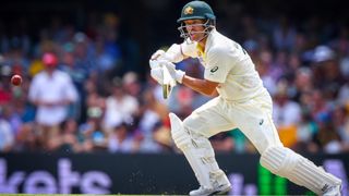 David Warner drives a ball during day two of the first Ashes cricket Test match between England and Australia at the Gabba in Brisbane