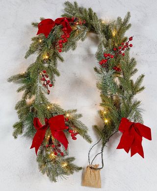 snowy led christmas garland with red ribbon