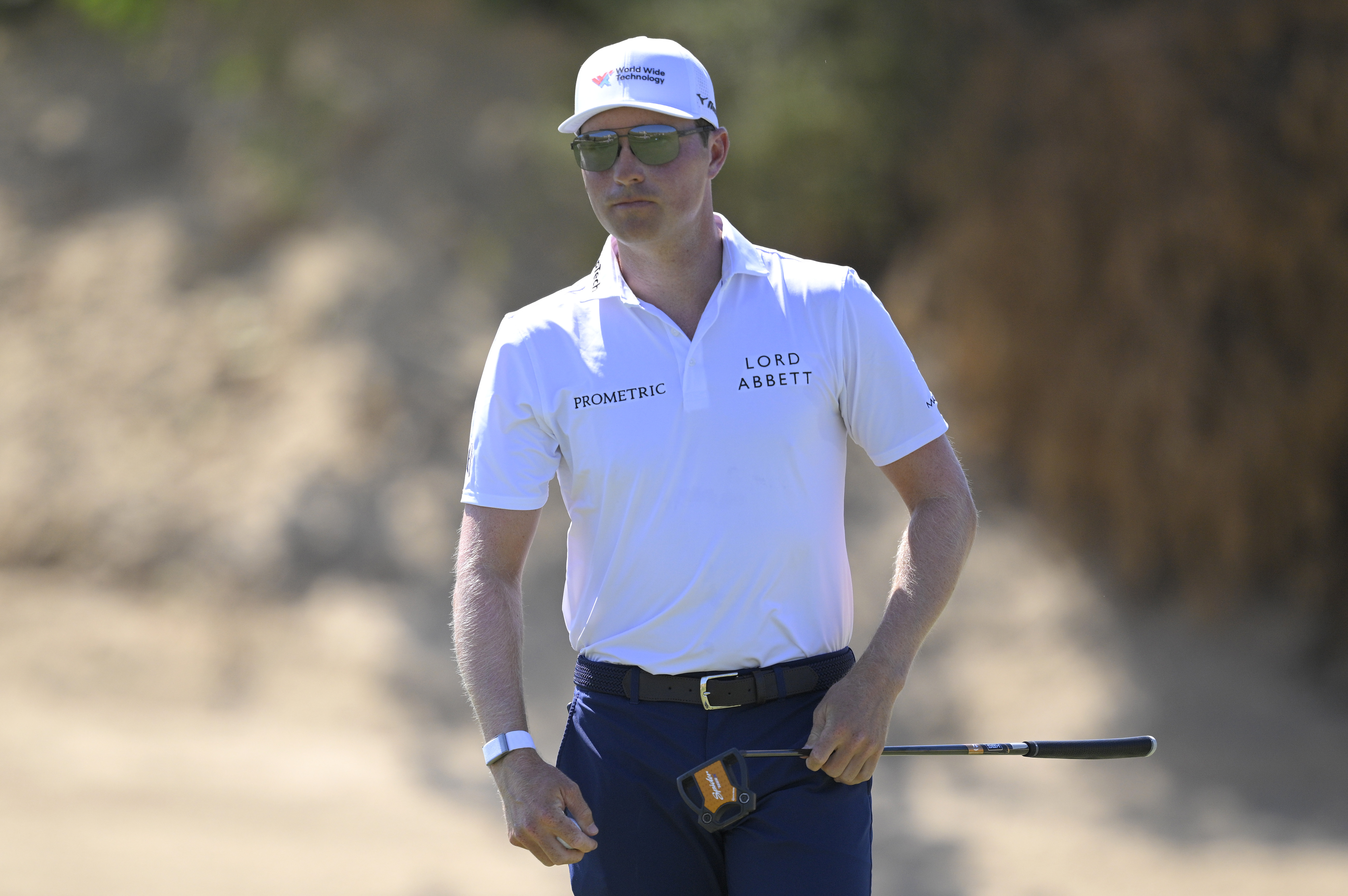 Ben Griffin walks off the green with his putter