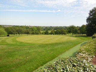 The 18th green seen from the terrace at Highgate Golf Club