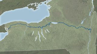 A map with various green and blue features corresponding to land and Lake Erie, with a blue ribbon of water showing the Erie canal across the image