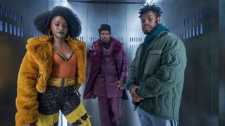 Teyonah Parris, Jamie Foxx and John Boyega standing in an elevator in the film They Cloned Tyrone