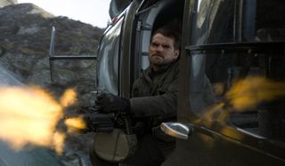 Henry Cavill fires off a gatling gun from a helicopter in Mission: Impossible - Fallout