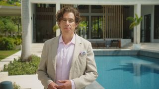 Stephen Mangan in front of The Fortune Hotel resort.