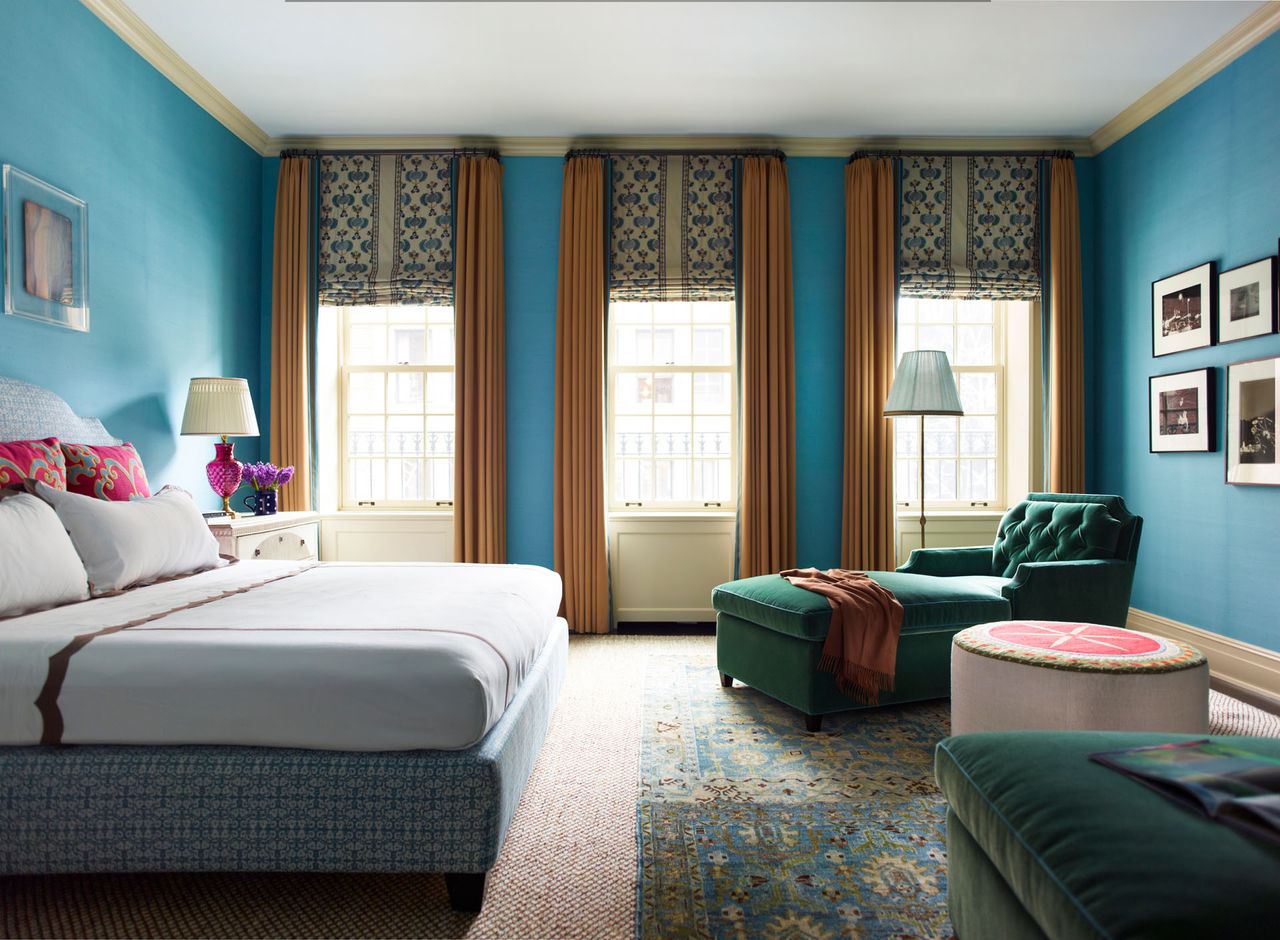 Blue bedroom with green upholstery