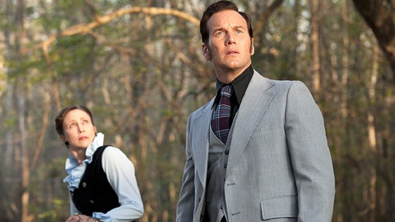 Ed and Lorraine Warren look on in disbelief at someone off camera in The Conjuring