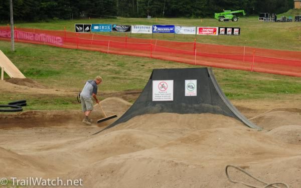 A lone worker gets the pump track ready for a busy day
