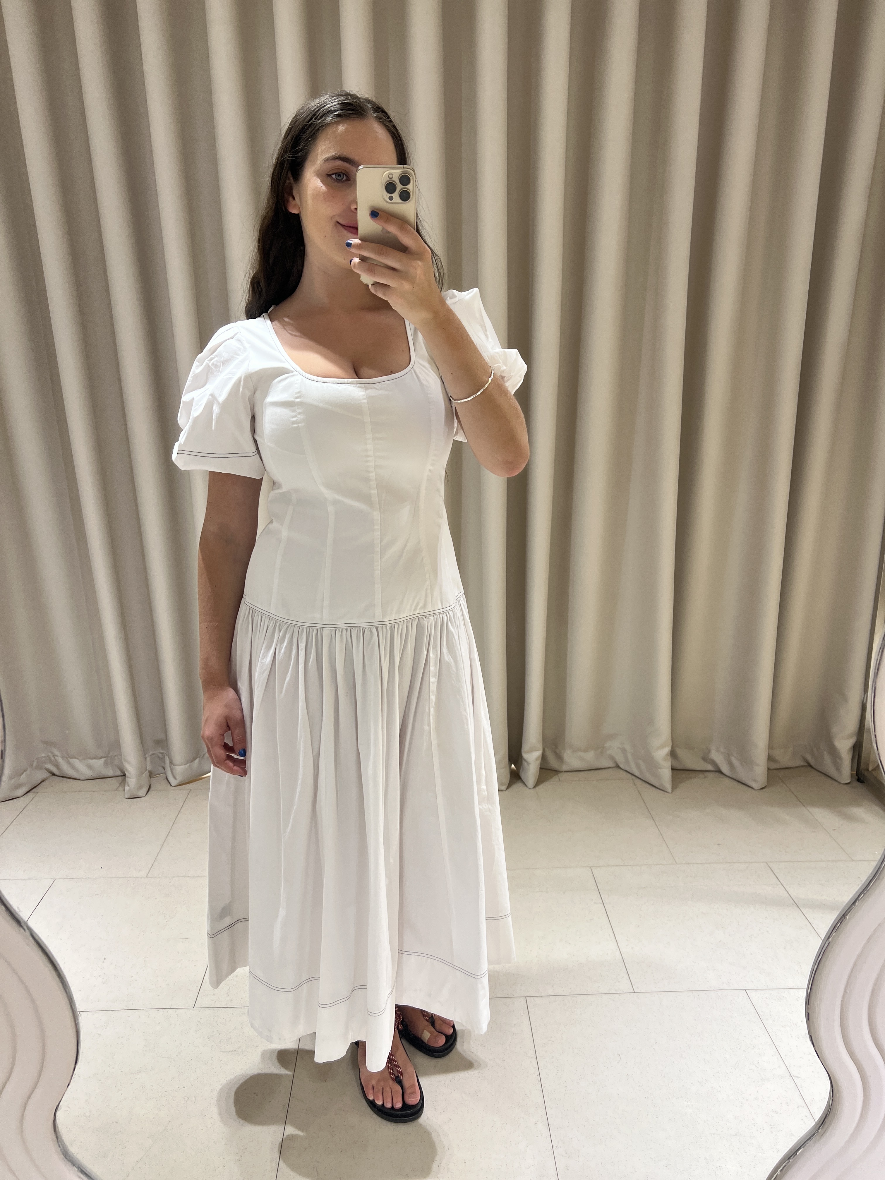 An image of Who What Wear UK's fashion writer, Ava Gilchrist, wearing M&amp;S's new spring 2026 collection, including a white puff-sleeve dress and rope sandals.