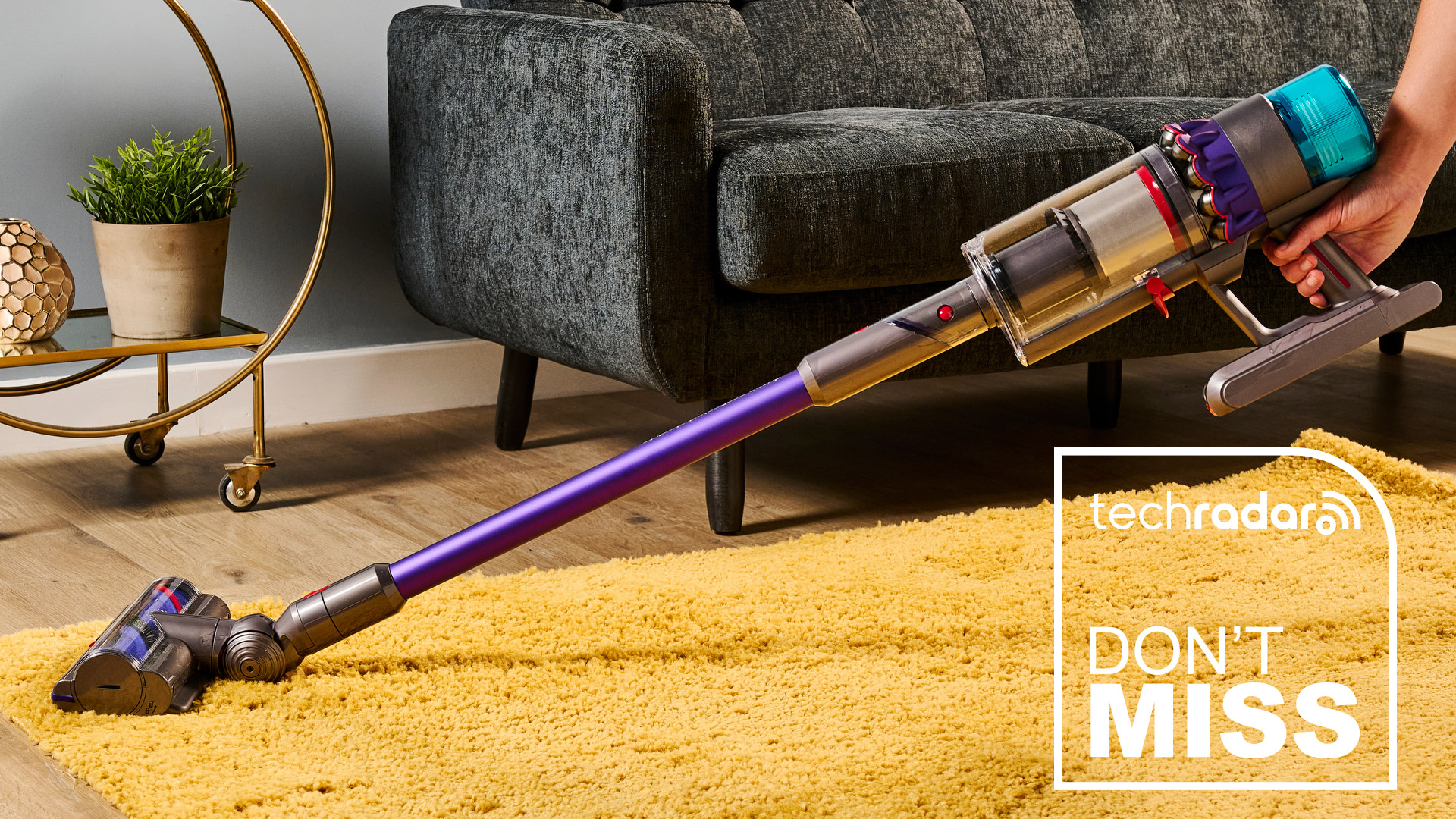 Dyson Gen5 Detect vacuum cleaner being used on a yellow rug