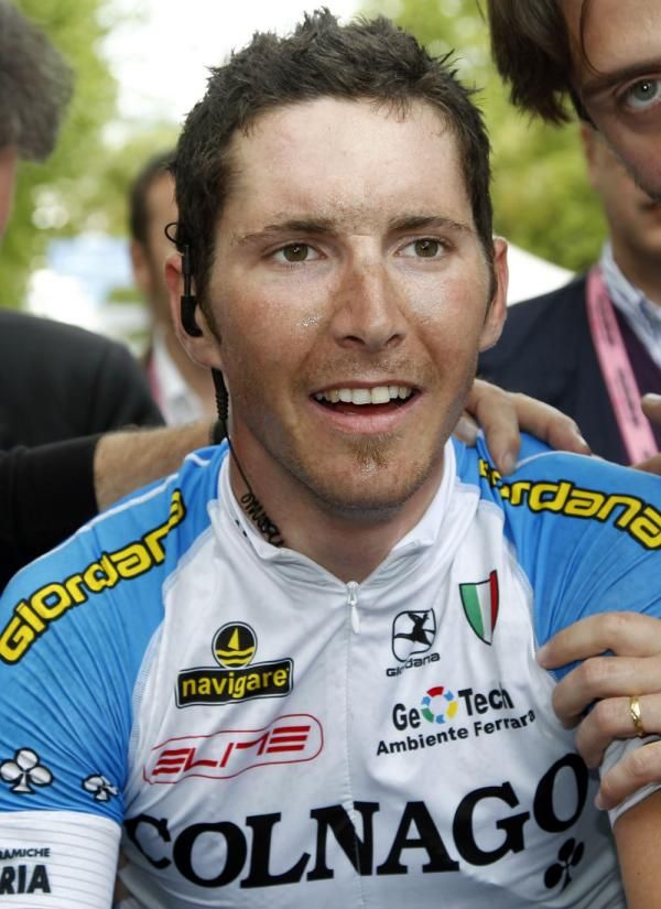 Manuel Belletti (Colnago-CSF Inox) is escorted to the podium in Cesenatico