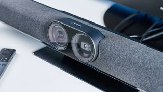 the insta360 is a black and grey video bar with 14 mics and a gimbal and 4k sensor, hdmi inputs and hdmi outputs, usb-c, usb-a, and bluetooth and wifi connectivity, perfect for medium-sized conference rooms