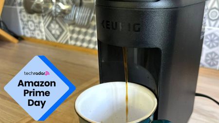 The Keurig K-Mini Mate machine pouring a cup of coffee
