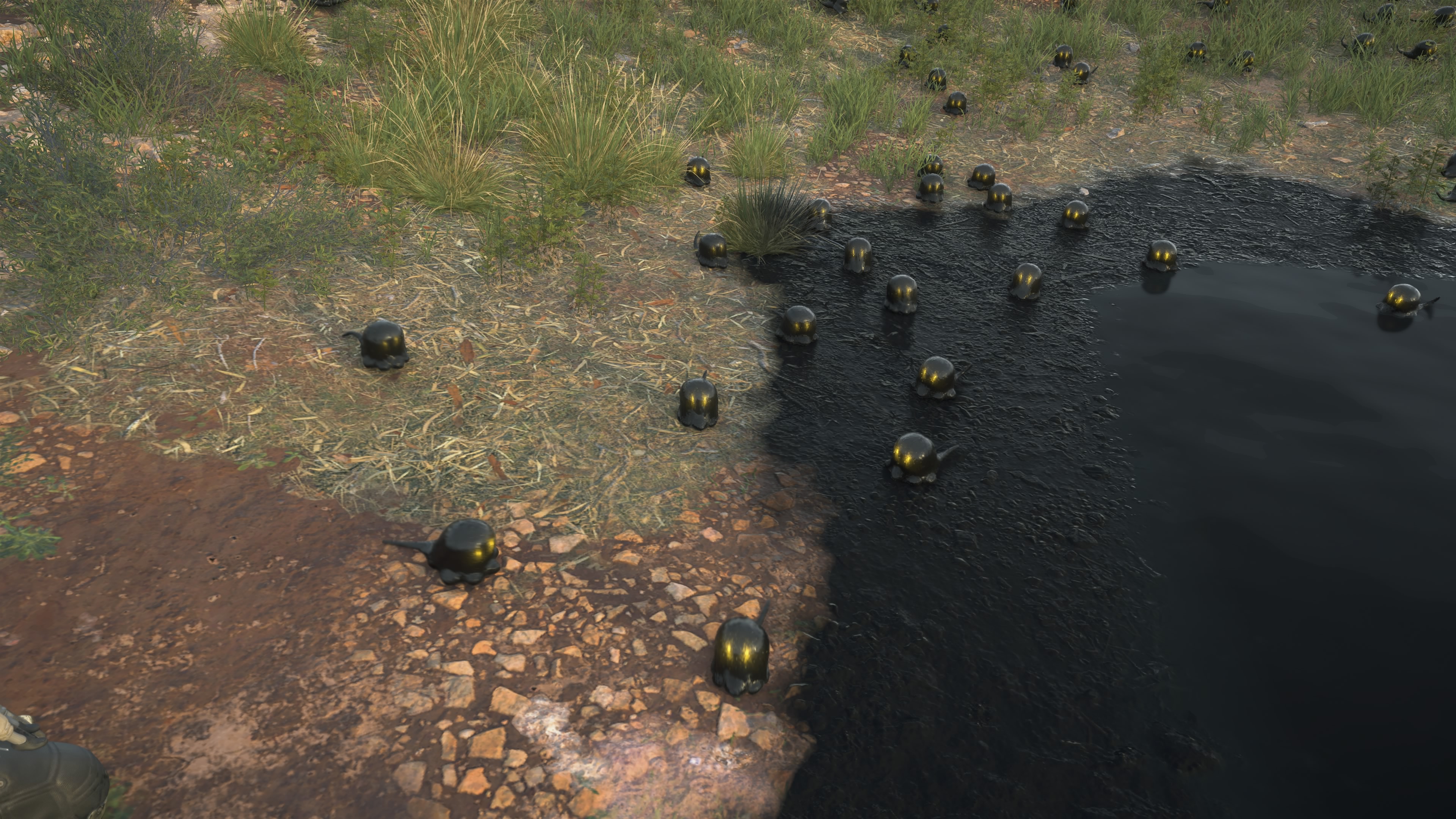 A group of black, oily chiral creatures in Death Stranding 2