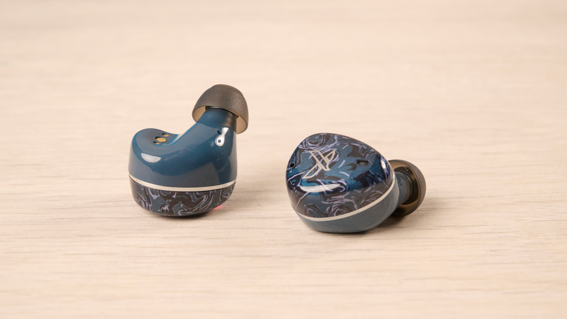 A pair of Noble Audio Osprey wireless earbuds
