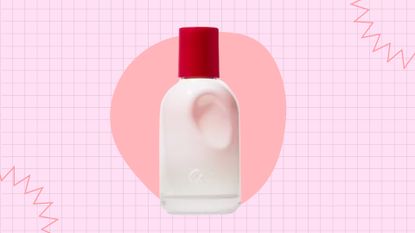 Perfumes like Glossier You: a bottle of Glossier You on a pink template, with a peach circle behind the bottle