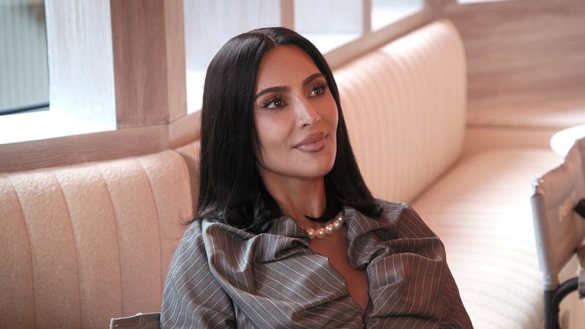 Kim Kardashian sitting on a couch in The Kardashians Season 7 on Hulu