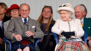 Prince Philip, Duke of Edinburgh and Queen Elizabeth II attend the Braemar Gathering at the The Princess Royal and Duke of Fife Memorial Park on September 6, 2014