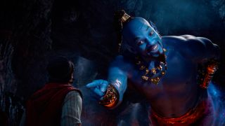 (R, L) Will Smith as the Genie points to Mena Massoud as Aladdin in Aladdin (20219)