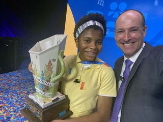 Adam Symson takes an on-stage selfie with champion Zaila Avant-garde at the Scripps National Spelling Bee.