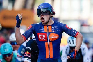 Team Picnic PostNL's Dutch rider Casper van Uden celebrates as he crosses the finish line as winner of stage 4 at the 2025 Giro d'Italia