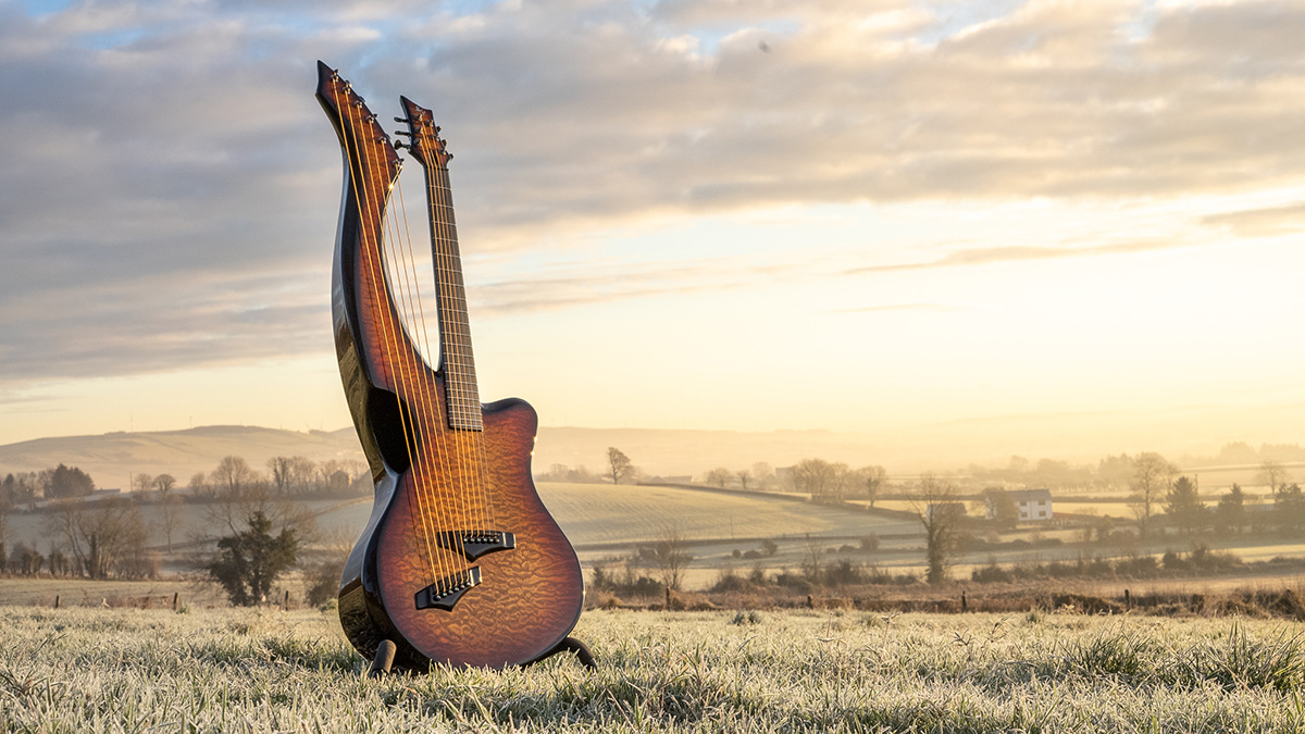 An Emerald guitar against an Irish countryside backdrop