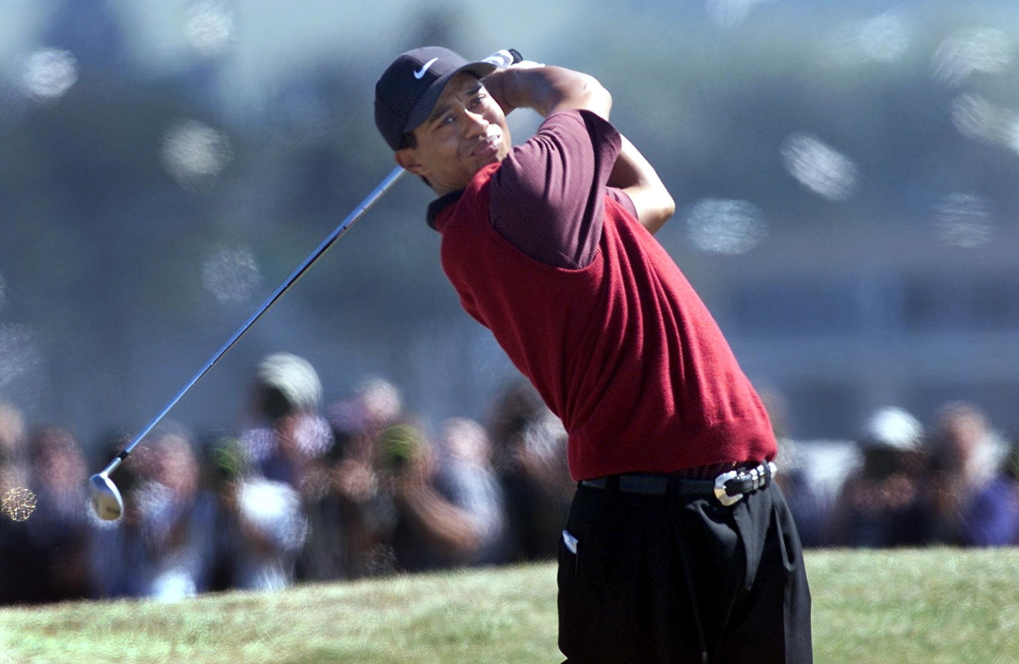 Tiger Woods hits a driver off the tee