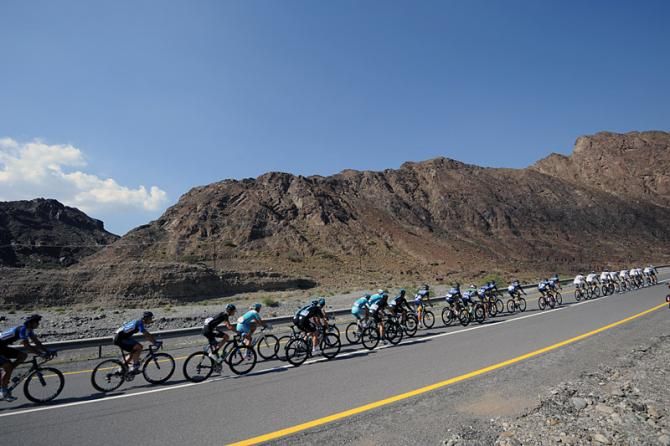 The peloton makes its way through the stark Omani landscape during stage 1.
