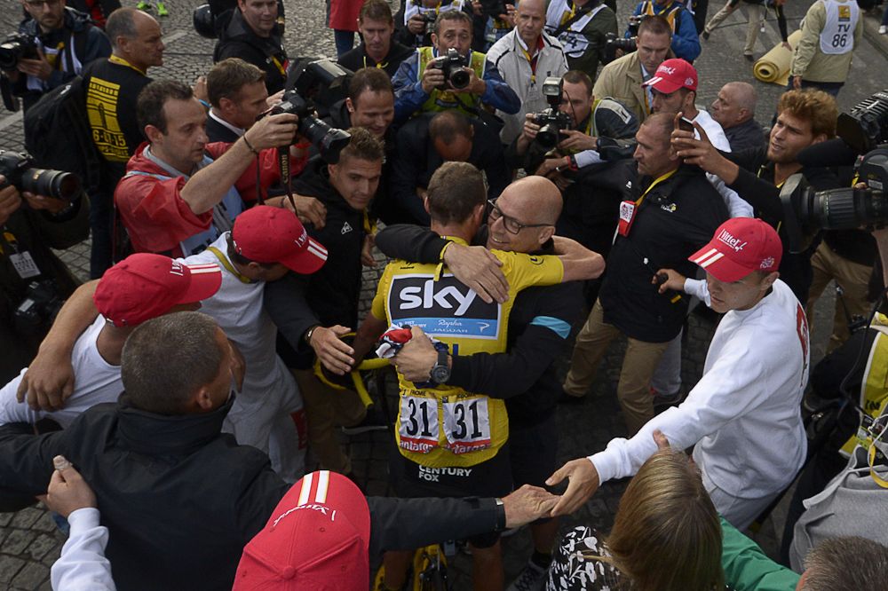 Dave Brailsford and Chris Froome embrace following the 2015 Tour de France.