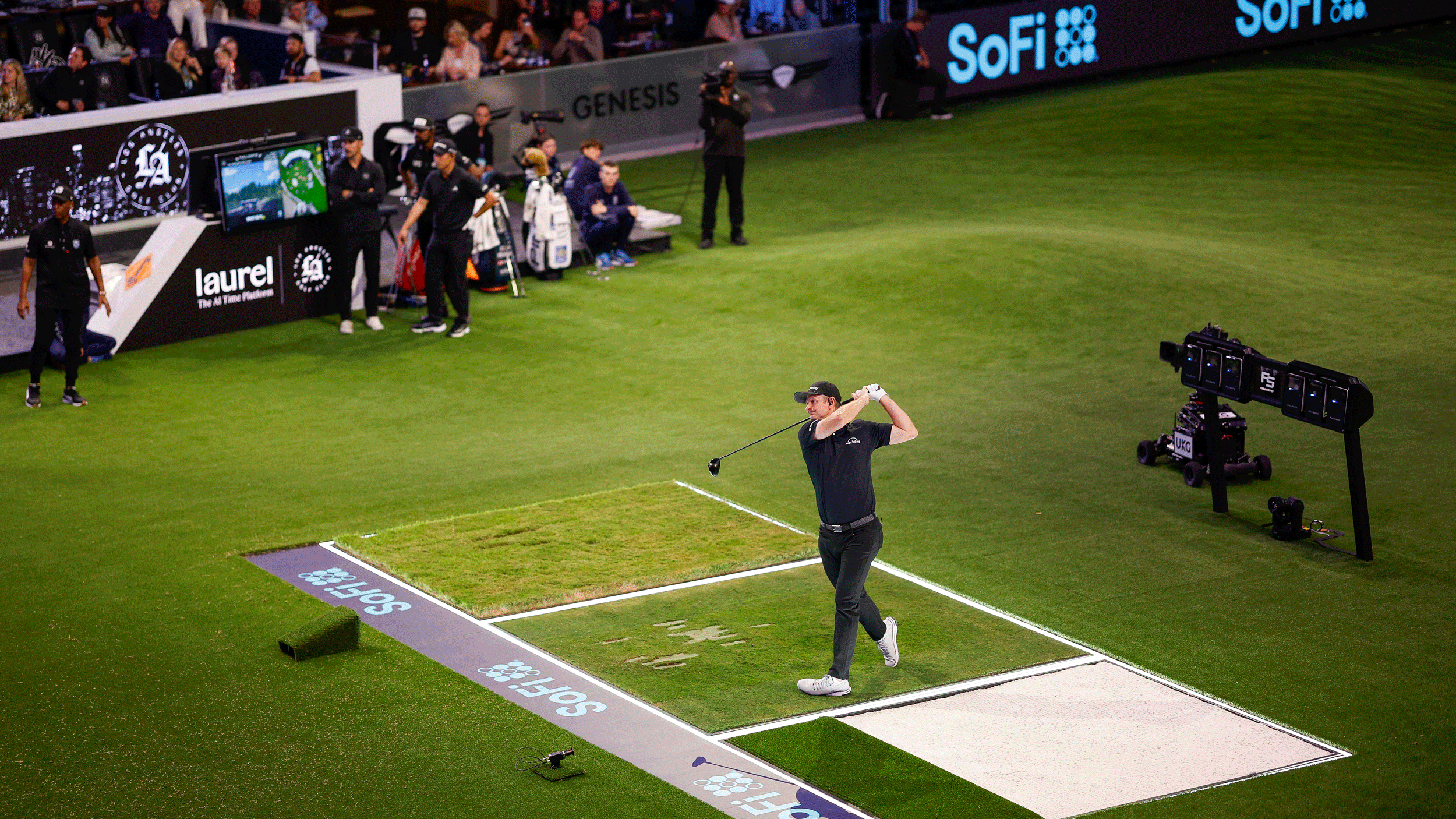 Justin Rose hits a drive during season two of TGL