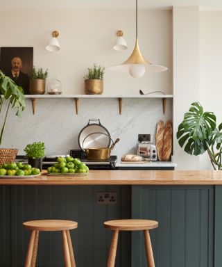 Dark blue and white wooden kitchen by deVOL