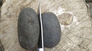 camping knife between two rocks