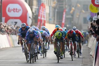 DE PANNE BELGIUM MARCH 20 LR Tim Merlier of Belgium and Team SoudalQuick Step Jasper Philipsen of Belgium and Team AlpecinDeceuninck Danny van Poppel of The Netherlands and Team BoraHansgrohe Jason Tesson of France and Team TotalEnergies and Simone Consonni of Italy and Team LidlTrek sprint at finish line to win during the 48th Classic BruggeDe Panne 2024 Mens Elite a 1989km one day race from Brugge to De Panne UCIWT on March 20 2024 in De Panne Belgium Photo by Luc ClaessenGetty Images