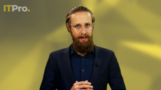 Presenter Ant Joblin on a yellow background talking to the camera