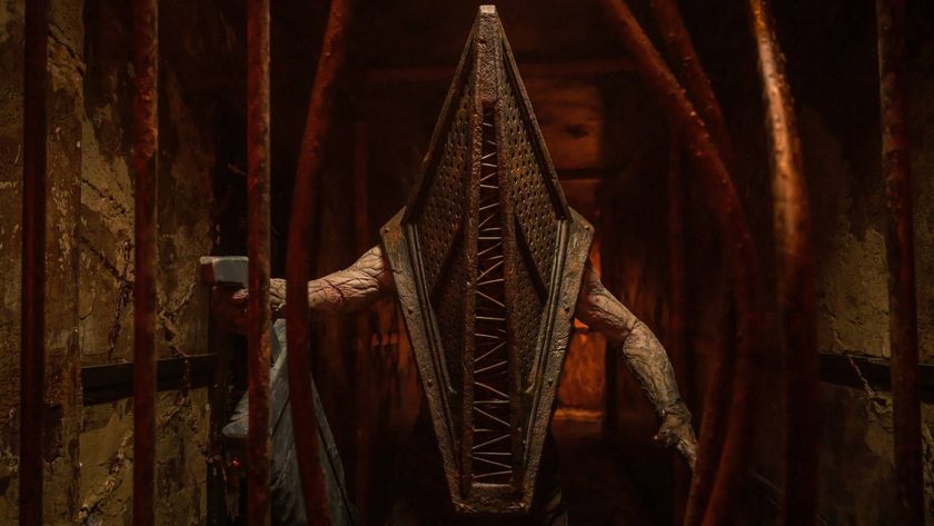 Pyramid head peering through bent bars in Return to Silent Hill